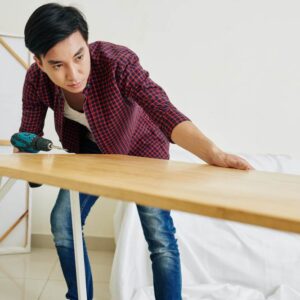 A carpenter is making a bench (illustration)